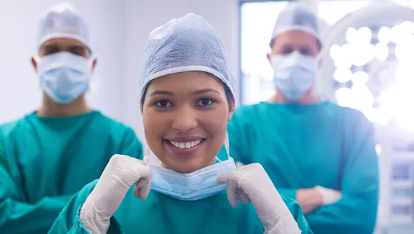 Three doctors standing together, representing the medical team
